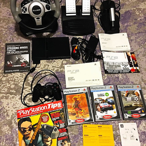 Playstation 2 Slim like new with steering wheel and 3 games