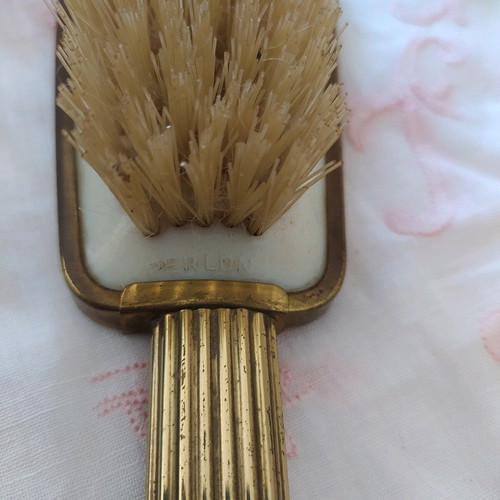 Old metal brush with embroidery used