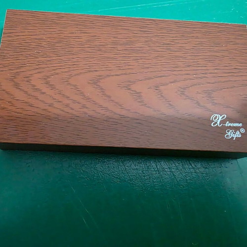Set of three gifts in luxury wooden box with pen, lighter and keychain