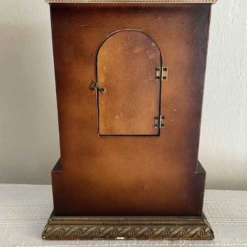 Vintage tabletop clock used with leather finish and brass carved details