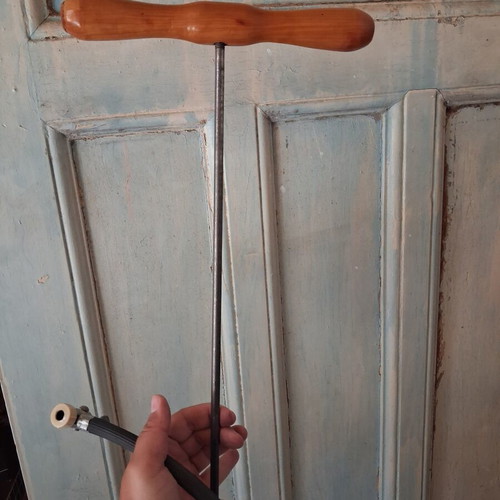 Manual air pump used with wooden handle and flexible hose