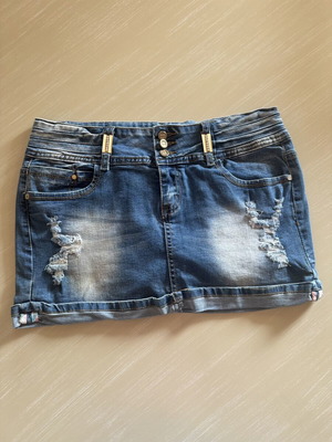 Denim mini skirt XL, dark blue with rips, like new