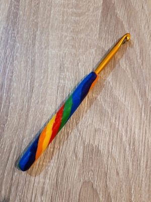 Crochet hook 6mm with rainbow polymer clay handle like new