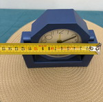 Blue analog table clock used, missing battery cover