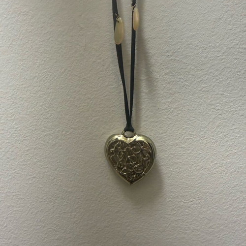 Long heart necklace with black cord like new, gold color