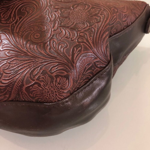 Women's brown shoulder bag used with embossed design