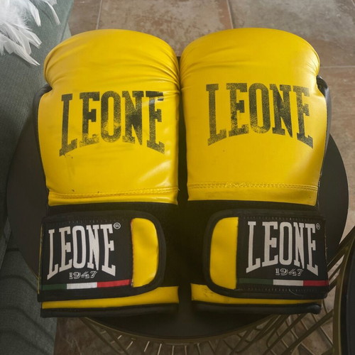 Kick boxing equipment used with gloves, wraps, shin guards, mouthguard, and bag