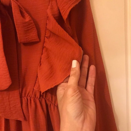 Coral dress like new with ruffles and front frill