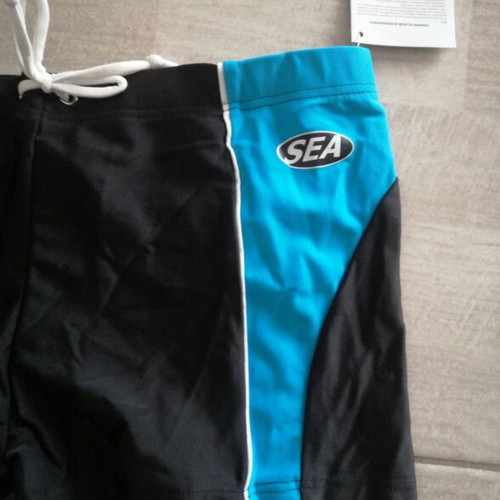 Children's swim trunks new, black and blue