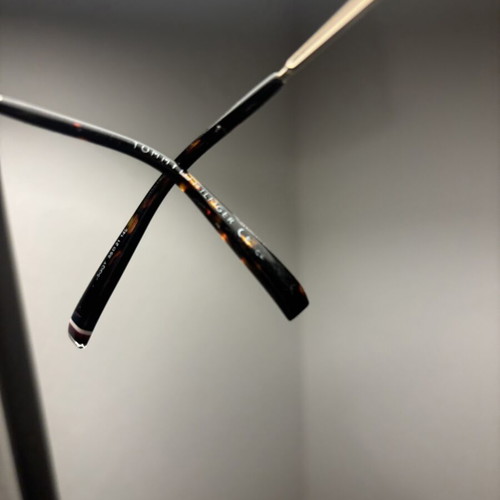 Tommy Hilfiger sunglasses with gold frame and dark lenses
