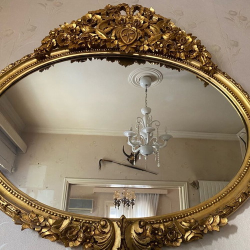 Vintage oval wooden carved mirror used in gold color