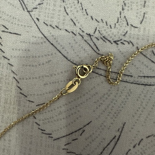 14k gold cross pendant with 9k long chain, reversible design