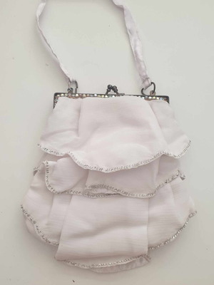 White hand bag new with decorative ruffles and rhinestones