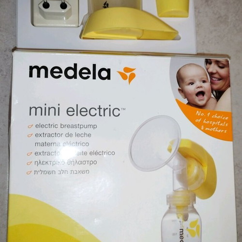 Medela mini electric electric breast pump used with two pumps and chargers