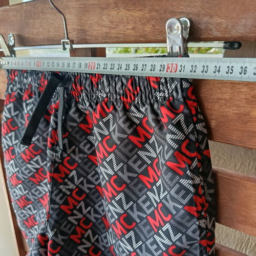 McKenzie Shorts Swimwear new, black with red print, size 12-13 years