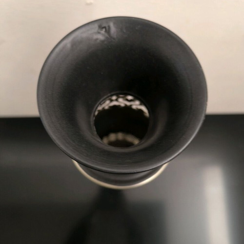 Metal vase in black color with bronze designs like new