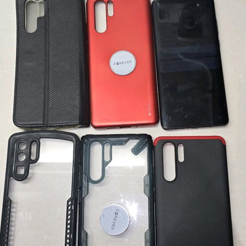 Huawei P30 Pro used with 5 cases, 2 headphones, charger, and box