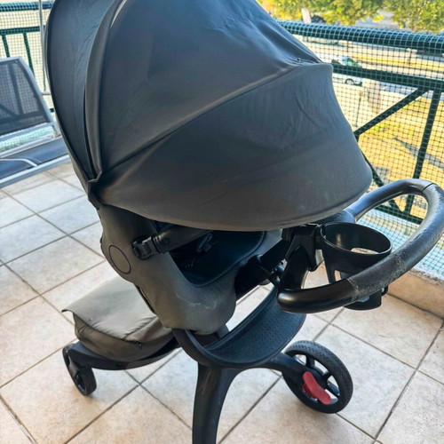 Stokke Xplory X Rich Black stroller used with gift bag set, changing mat, pouch