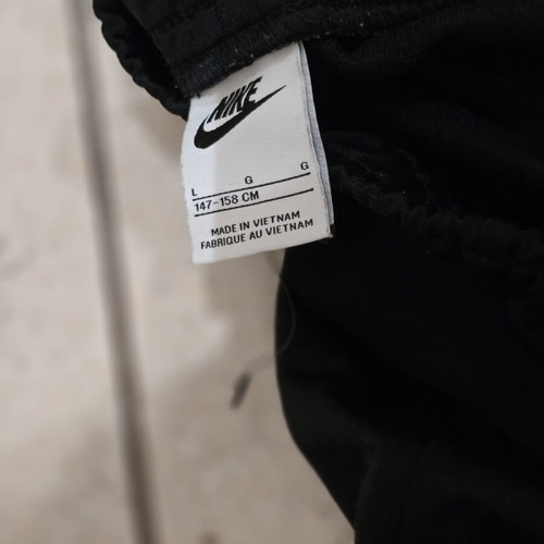 Nike kids' black tracksuit pants like new for ages 9-12