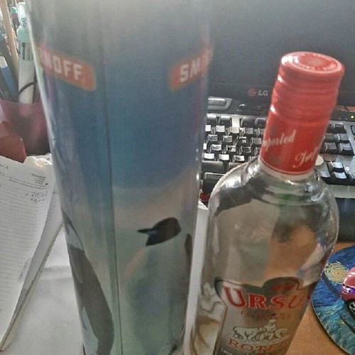 Smirnoff collectible tin and Ursus Rotter red bottle used