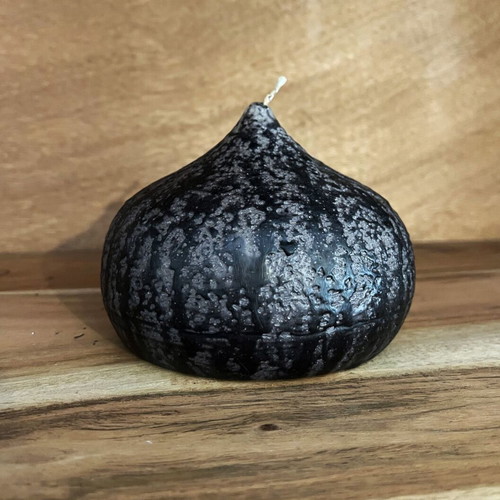 Decorative wax candle in flame shape