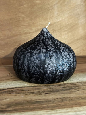 Decorative wax candle in flame shape