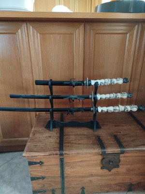 Set of 3 Samurai Swords with Skull Handles and Wooden Stand like new
