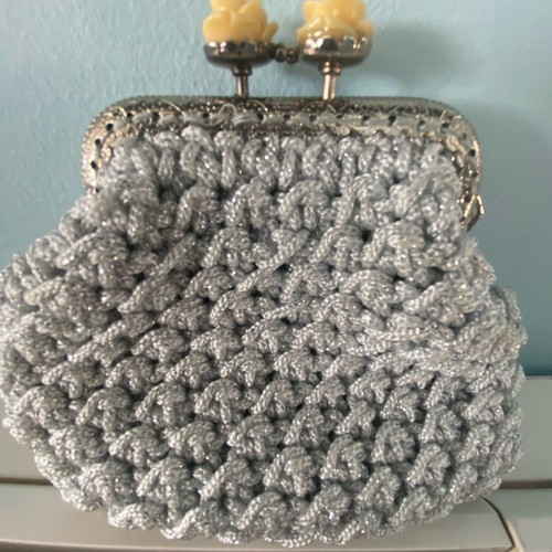 Handmade knitted wallet like new, medium size, silver with rose clip