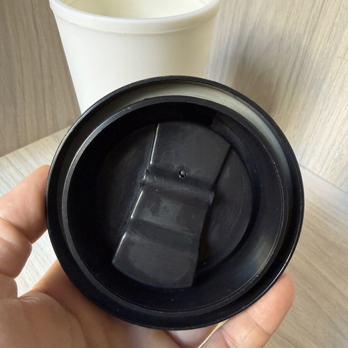 Reusable plastic coffee cup with screw lid