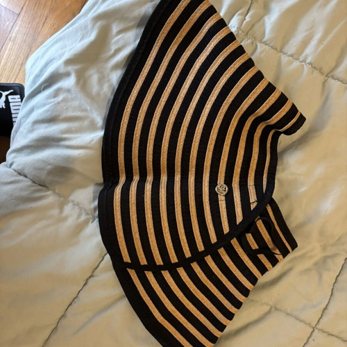 Steve Madden bucket hat with striped design and adjustable opening for ponytail