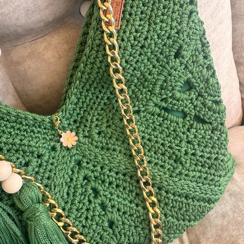Handmade green shoulder bag with gold chain and decorative tassels