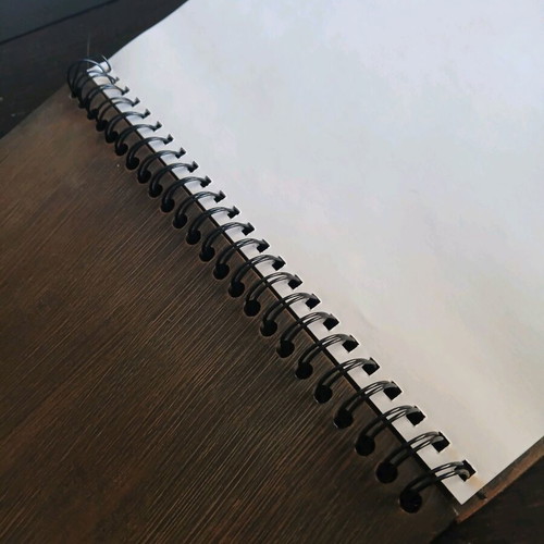 Iron notebook like new with embossed designs and magnet