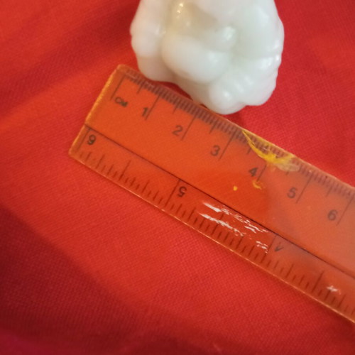 Alabaster-style miniature Buddha, smiling