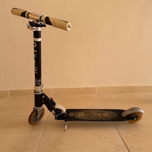 Micro scooter used, heavy-duty metal with stand