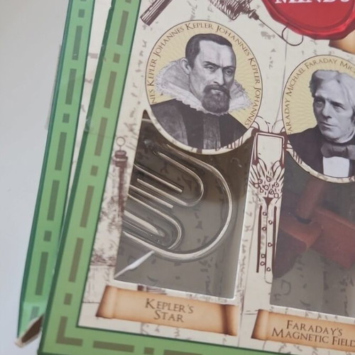 Great Minds Puzzle Set of 5 like new, 3 wooden and 2 metal puzzles