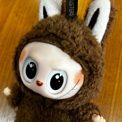 Labubu used brown figure from Pop Mart Monsters series