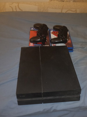 PlayStation 4 console like new with 2 DualShock 4 controllers and 6 games