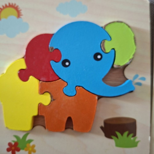 Wooden puzzles for children used, owl and elephant
