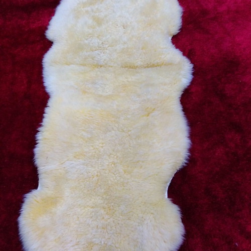 Sheepskin rug new, champagne color 2.05x0.75