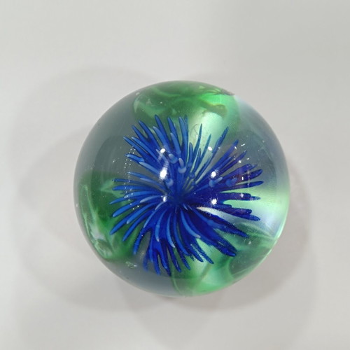 Vintage handmade art glass paperweight with blue flower