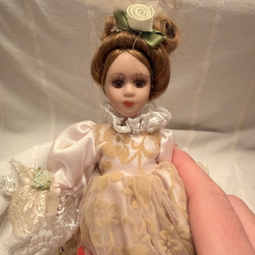 Porcelain doll vintage used, girl on stand
