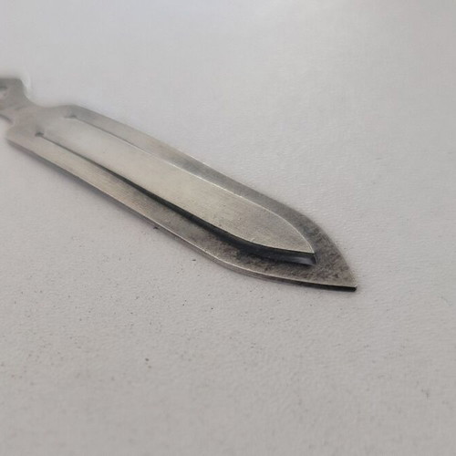 Silver bookmark with cross-shaped handle, used