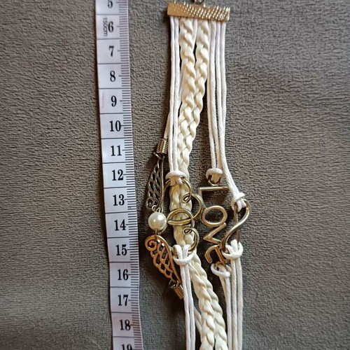 Love bracelet set new with white cords and charms