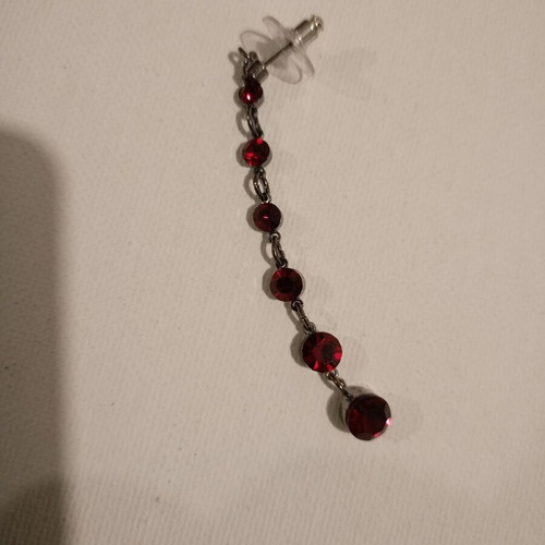 Women's earring like new with red stones single, silver