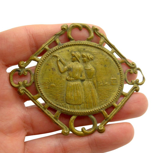 Antique brass decorative ornament with loving couple, like new