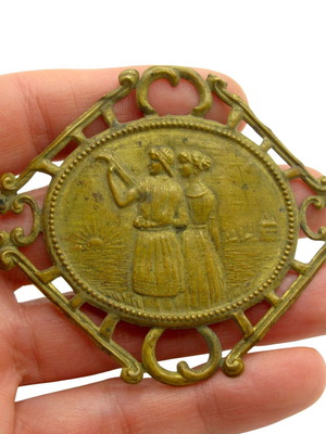 Antique brass decorative ornament with loving couple, like new