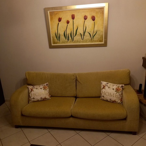 Sofa three-seater used with winter covers and two throws
