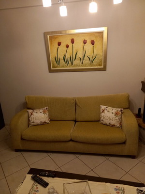 Sofa three-seater used with winter covers and two throws