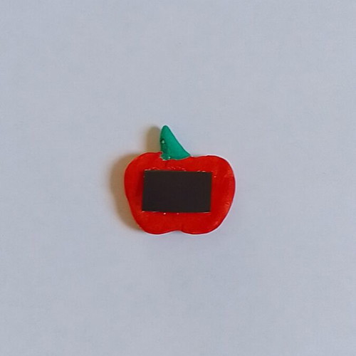 Handmade apple magnet from clay