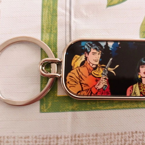 Set of 3 double-sided keychains with Jim Adams and Diana